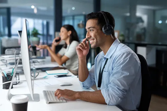 Truck dispatch team managing freight loads, broker communication, and delivery schedules